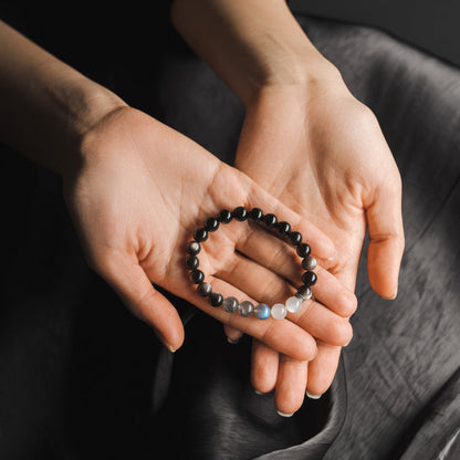 Chakra balancing beaded bracelet featuring calming moonstone and protective silver obsidian
